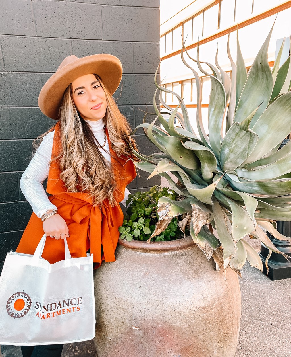 A Sundance team member holding a bag from the Sundance care program.