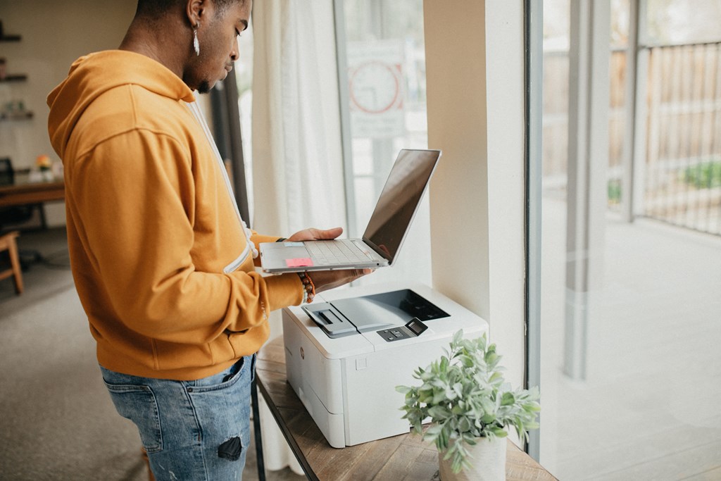 A resident uses the printing station at Sundance.