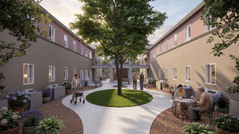 A courtyard with people sitting and walking around.