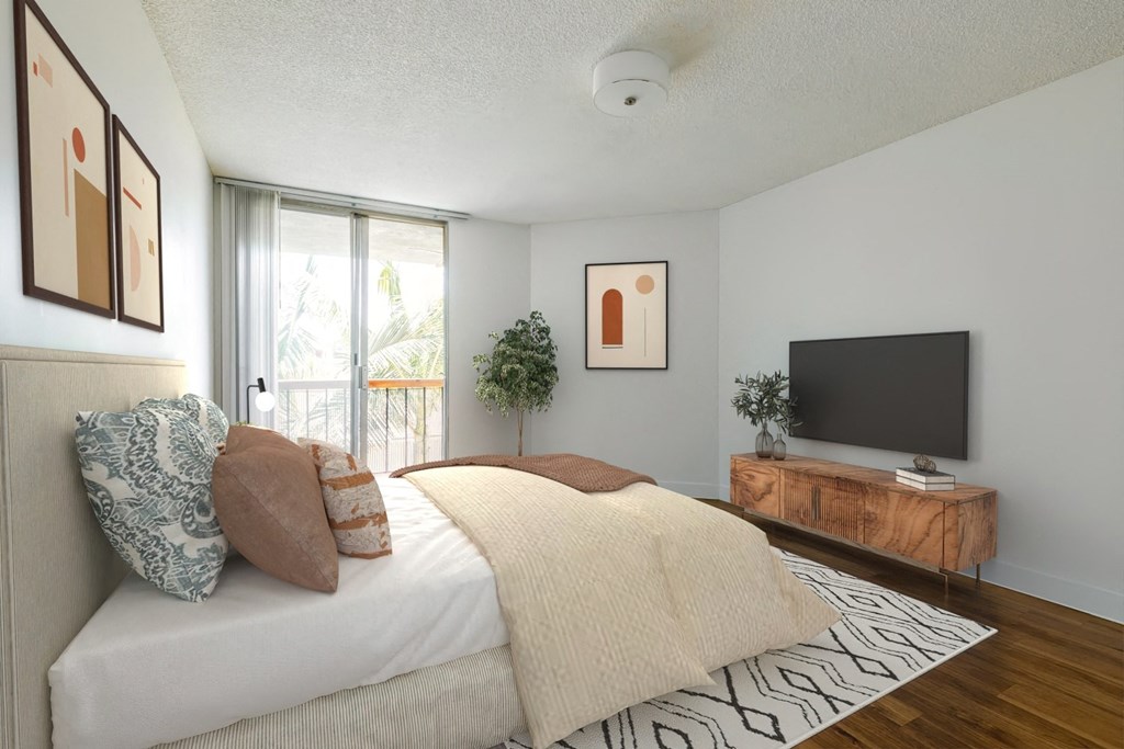 a bedroom with a bed and a tv