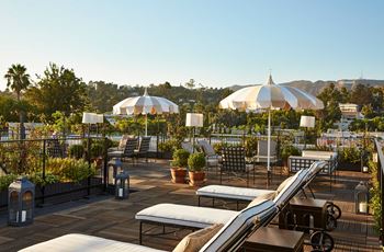 Villa Carlotta sundeck with lounge chairs and umbrellas