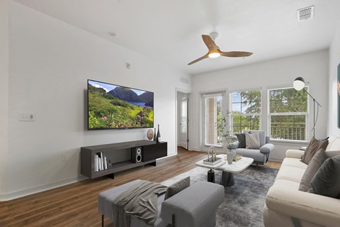 Living Room With Ceiling Fan at Park Place, Oviedo
