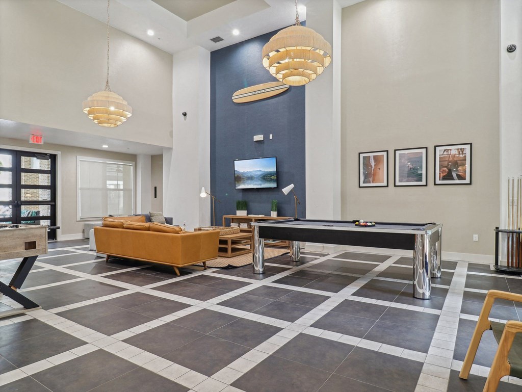 the preserve at ballantyne commons clubhouse with a pool table and tv
