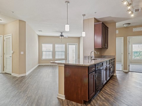 Empty kitchen with a large island in the middle  at Park Place, Oviedo, FL, 32765