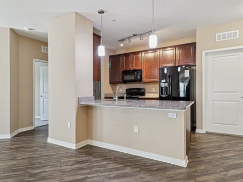 Empty kitchen with a counter top and  at Park Place, Oviedo, FL, 32765