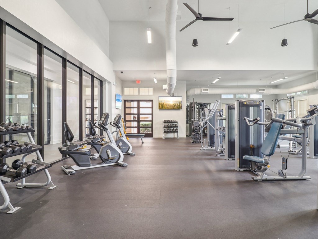 the gym at the flats at obsidian tower has cardio equipment and weights