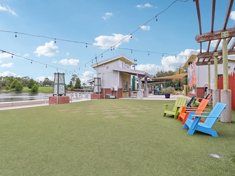 Patio with colorful chairs and a river in the background  at Park Place, Oviedo, FL, 32765