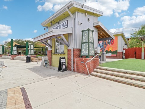 Front of a building with stairs and a sign on the sidewalk  at Park Place, Oviedo, FL, 32765
