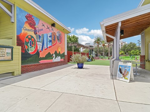 Mural on the side of a building with a sidewalk  at Park Place, Oviedo, FL, 32765