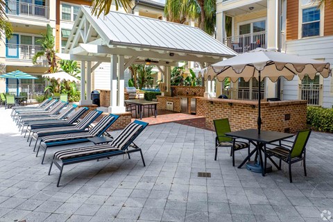 Row of chairs and umbrellas on a patio  at Park Place, Oviedo, FL, 32765