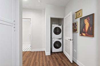 a small laundry room with a washer and dryer