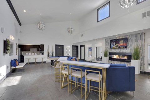 A modern dining area with a long table and chairs.