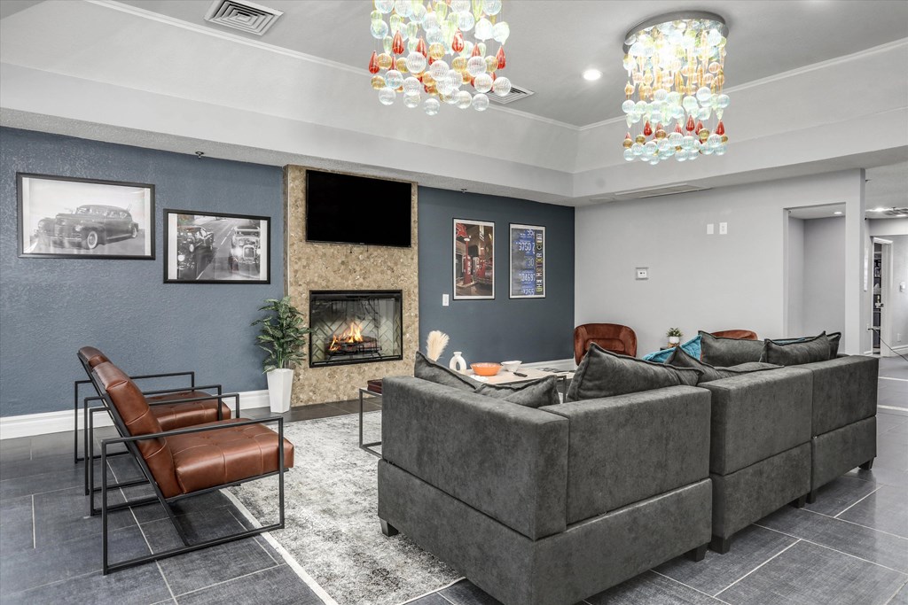 a living room with couches and chairs and a fireplace