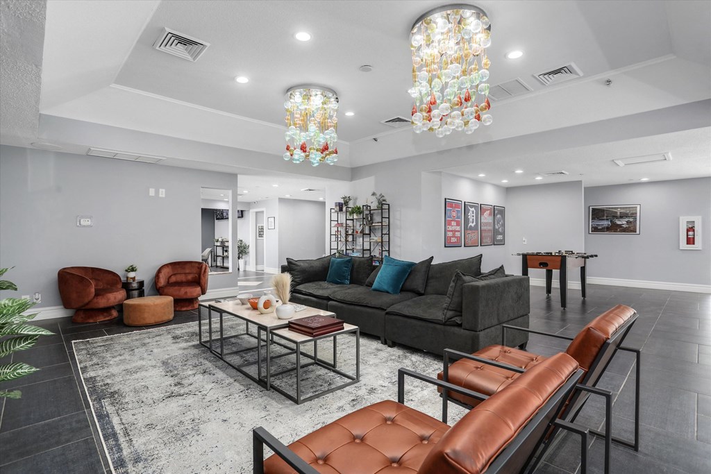 a living room with couches and chairs and a table