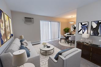 a living room with grey couches and chairs and a dining room with a table and chairs