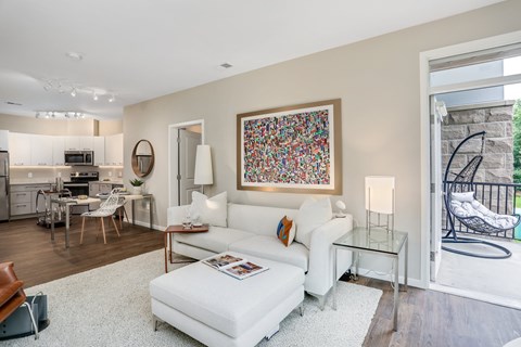a living room with a white couch and a coffee table
