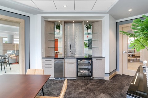 a kitchen with an island and a dining table