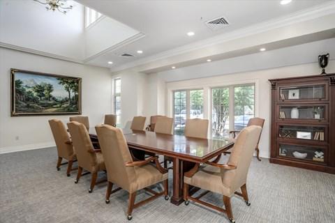 a conference room with a large table and chairs