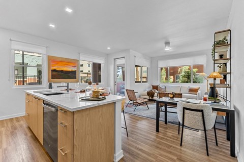 A modern kitchen with wooden cabinets and a large island.