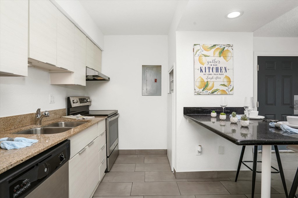 a kitchen with a counter top and a sink