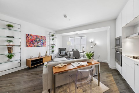 A modern kitchen with a dining table and chairs.