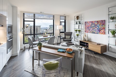 A modern kitchen with a dining table and chairs.