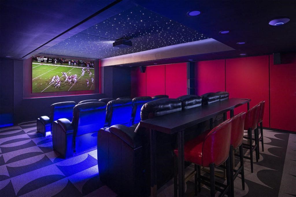 a dining room with a long table and chairs