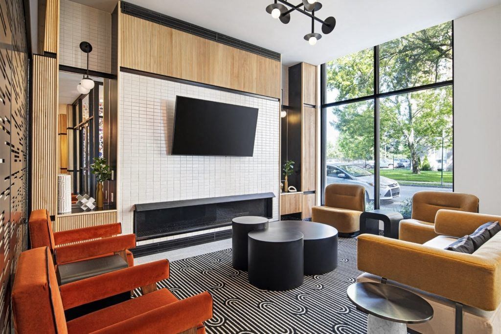 a living room with a fireplace and a television