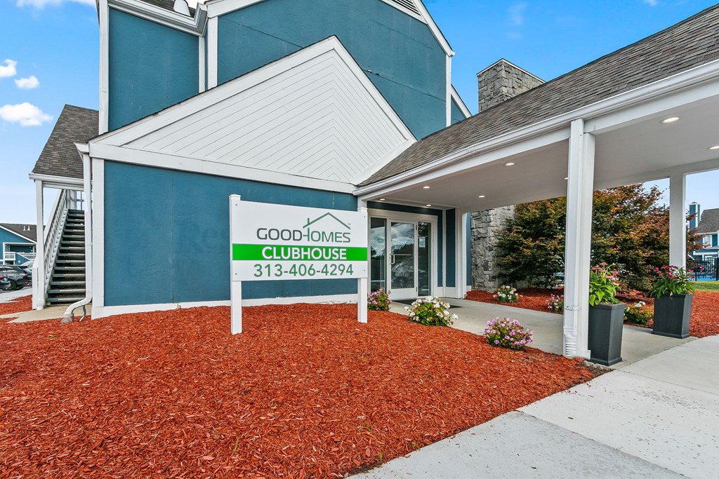 The front of a building with a sign that says Good Homes Clubhouse.