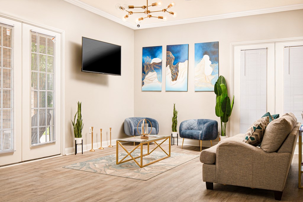 a living room filled with furniture and a flat screen tv