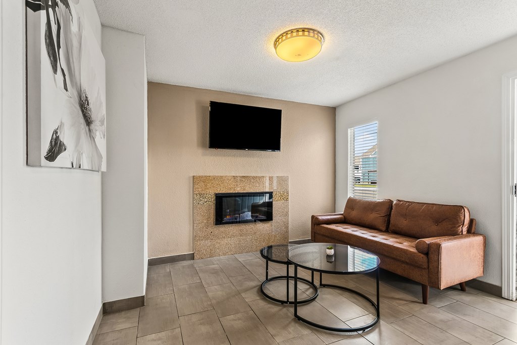 A living room with a fireplace and a couch.