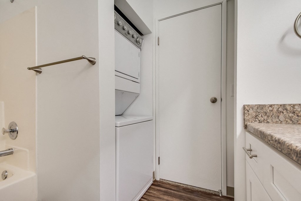 A white door with a handle is open.