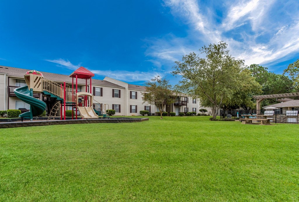 our apartments have a large yard with a playground
