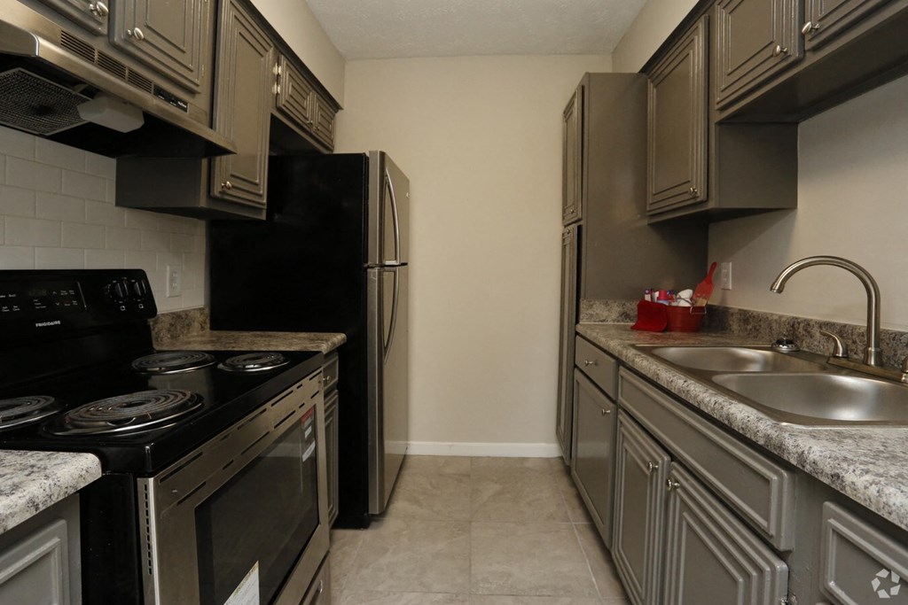 a kitchen with stainless steel appliances and granite counter tops and