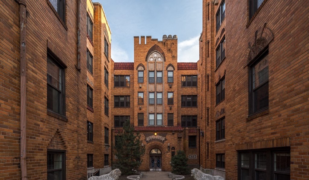 an old brick building with a clock tower in the middle
