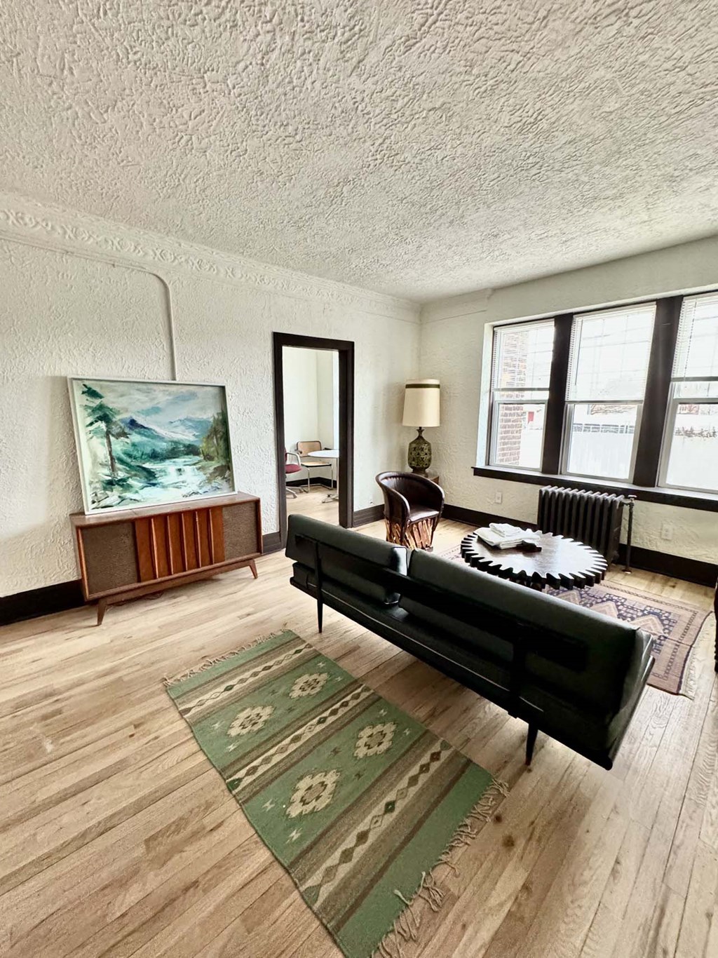 a living room with a couch and a table