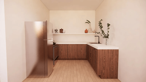 A kitchen with a refrigerator, wooden cabinets, and a plant on the counter.