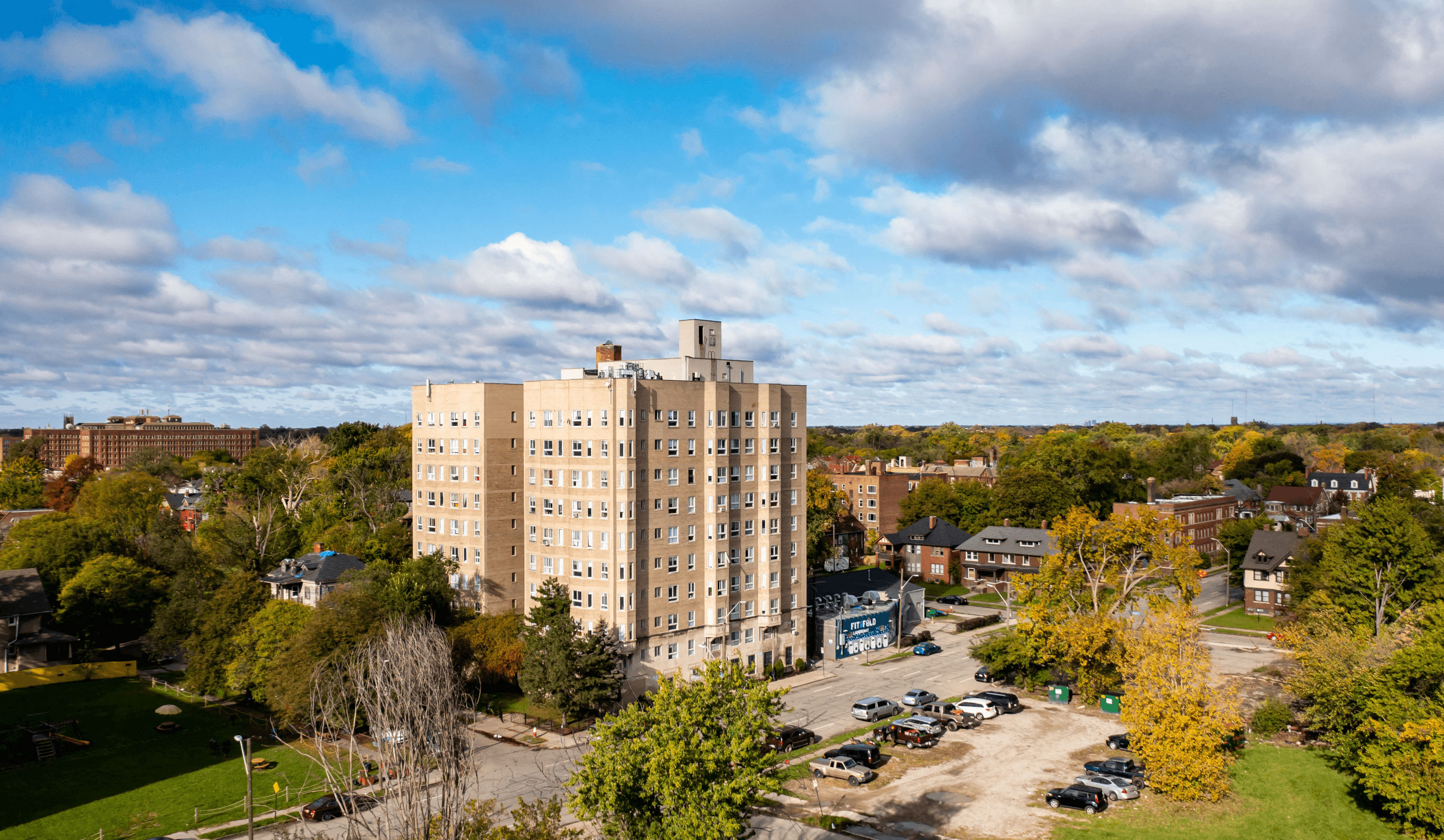 an aerial view of an apartment building in a city