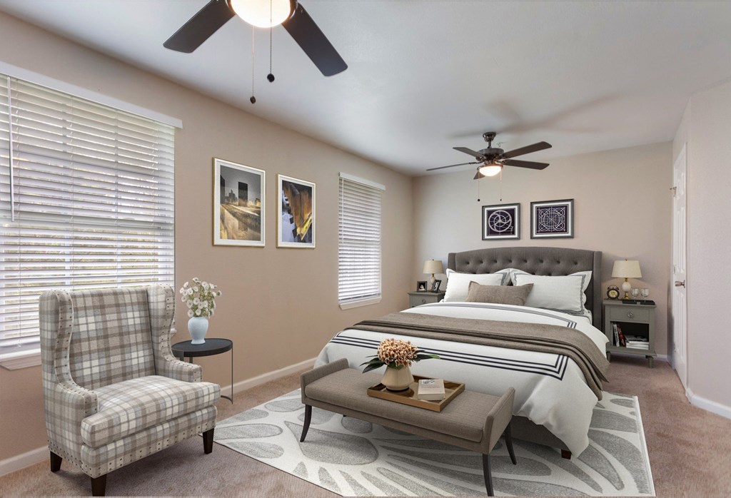 a bedroom with a bed and a ceiling fan