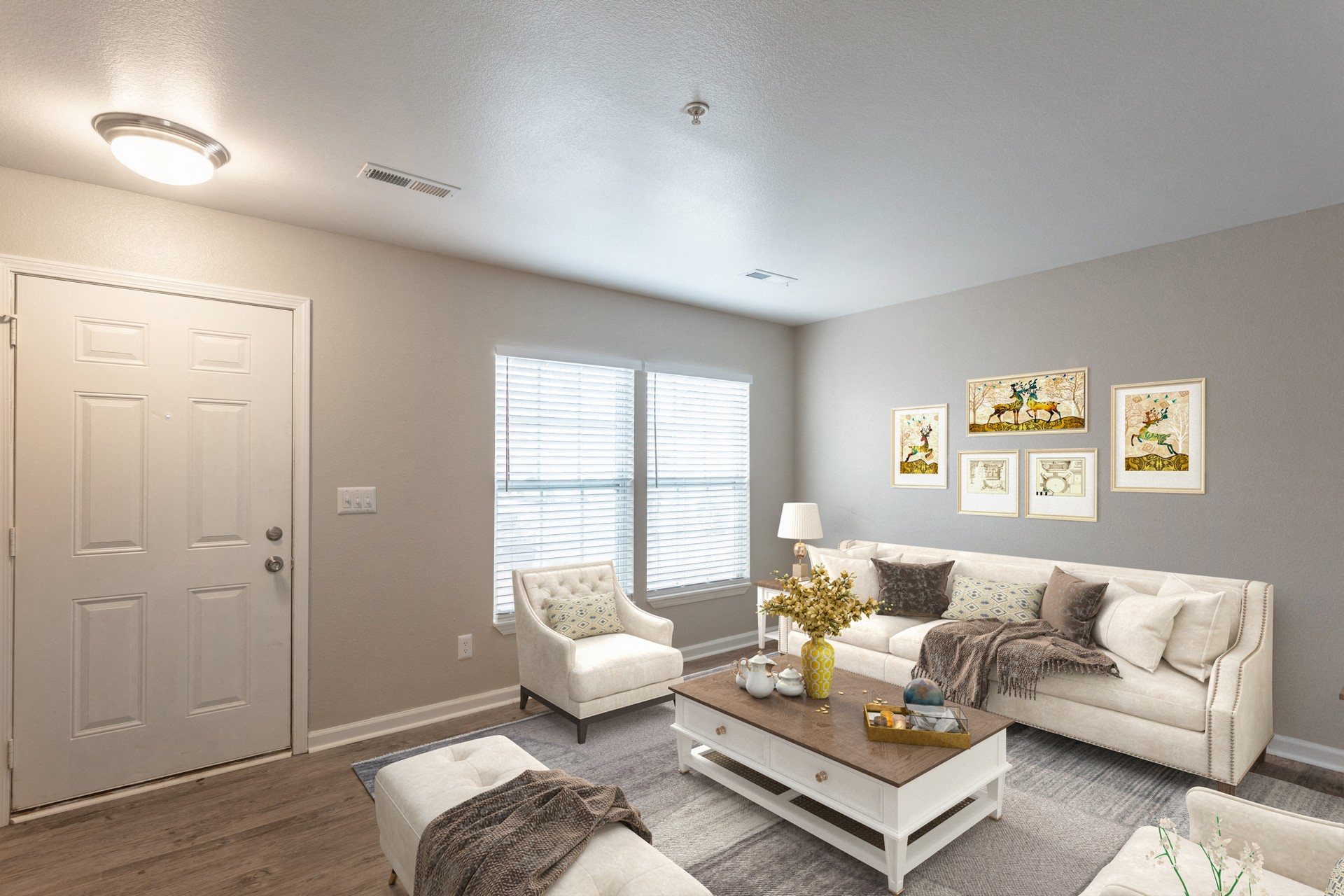 a living room with grey walls and white furniture