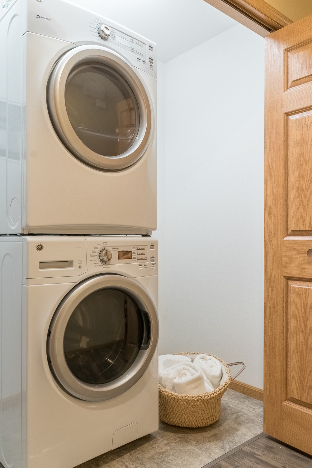 a front loading washer and dryer in a laundry room