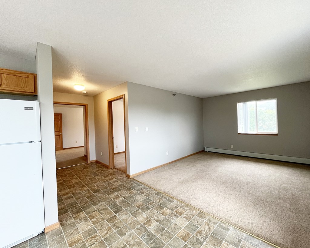 A room with a tile floor and a window.