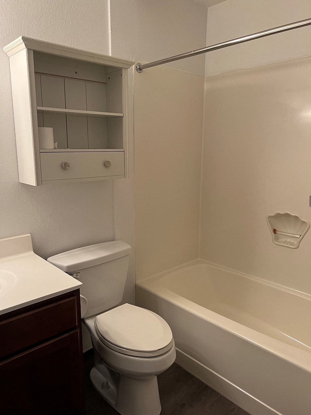 an empty bathroom with a sink toilet and bathtub