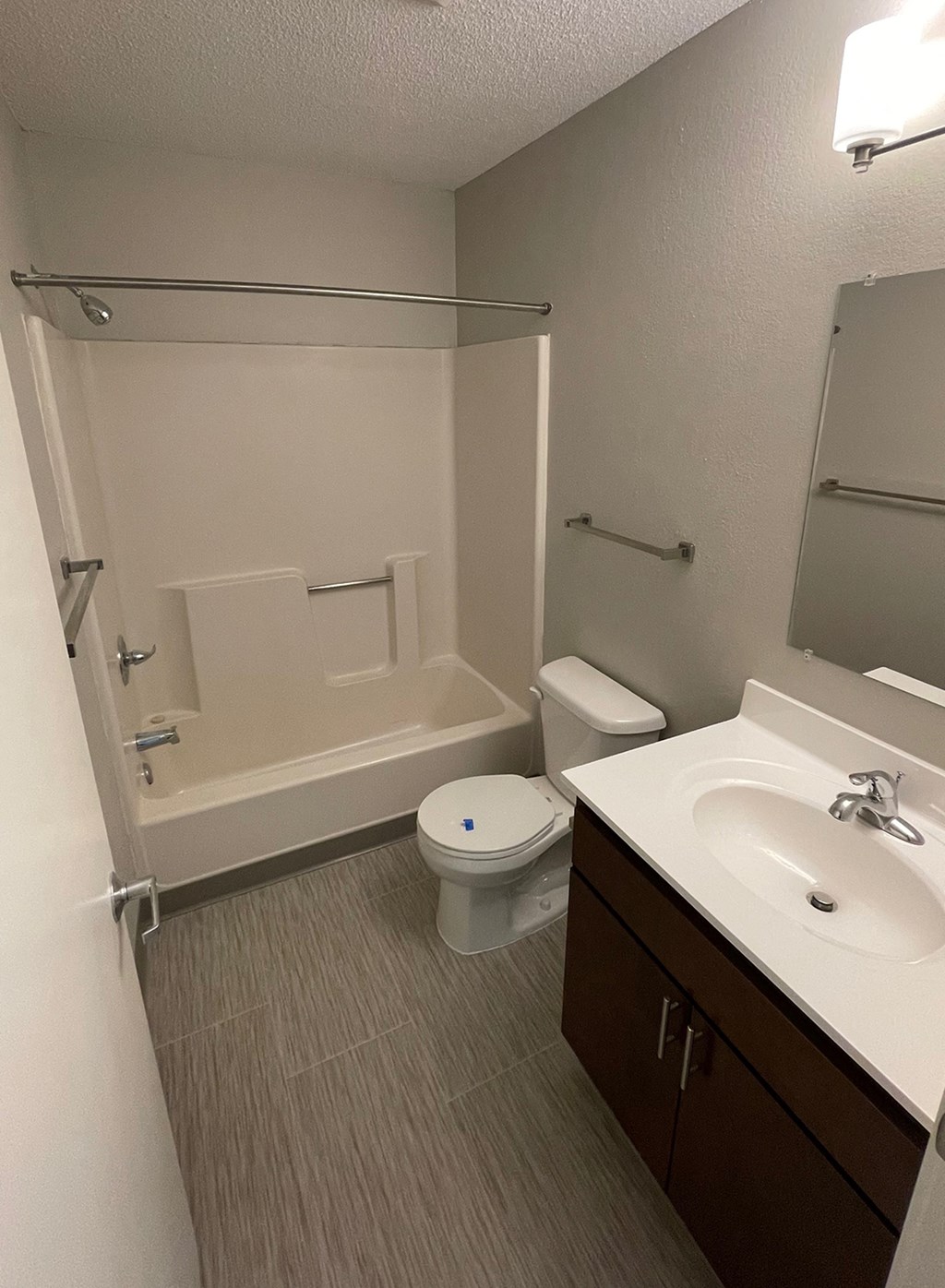 an empty bathroom with a sink toilet and bath tub