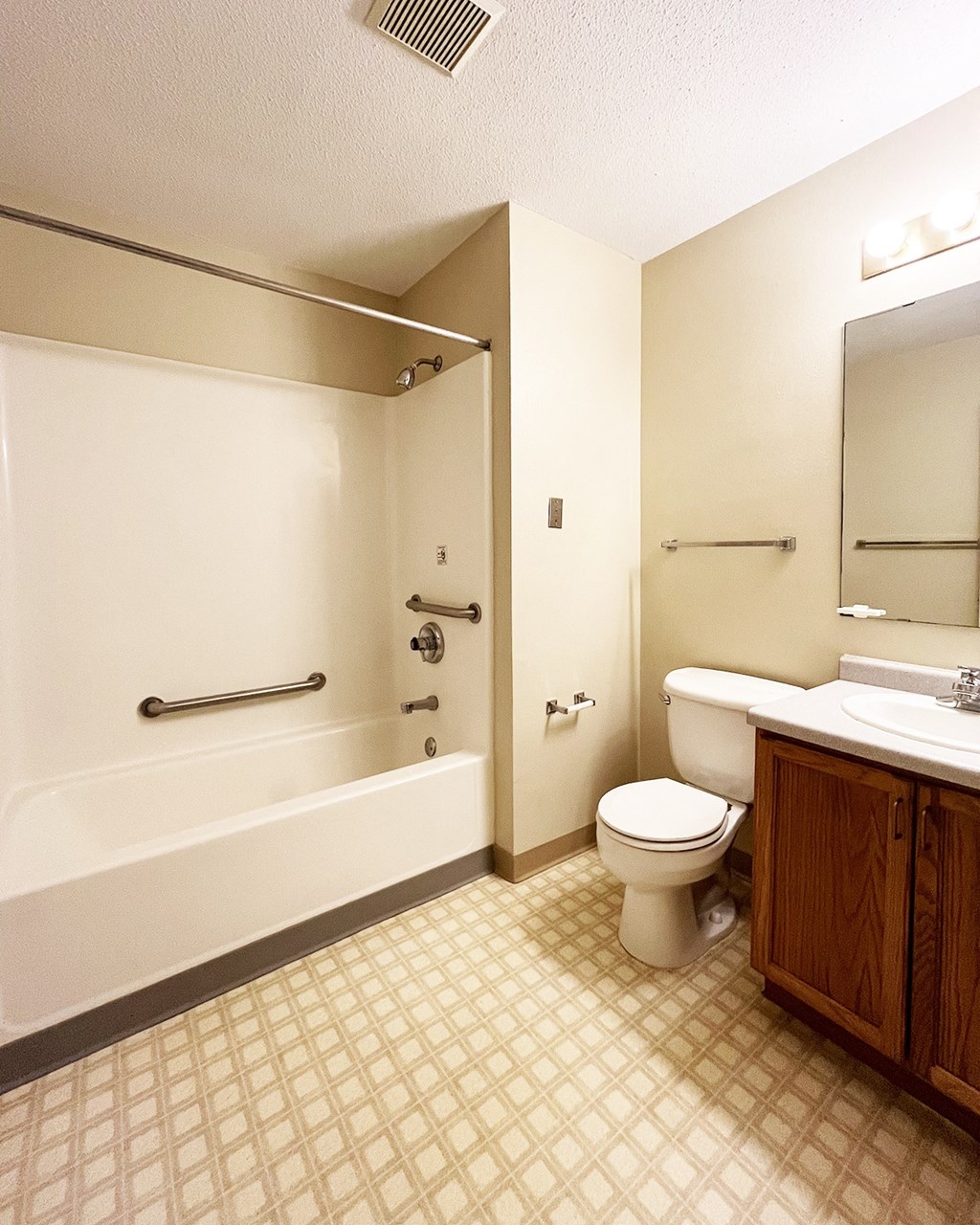 a bathroom with a toilet and a bath tub