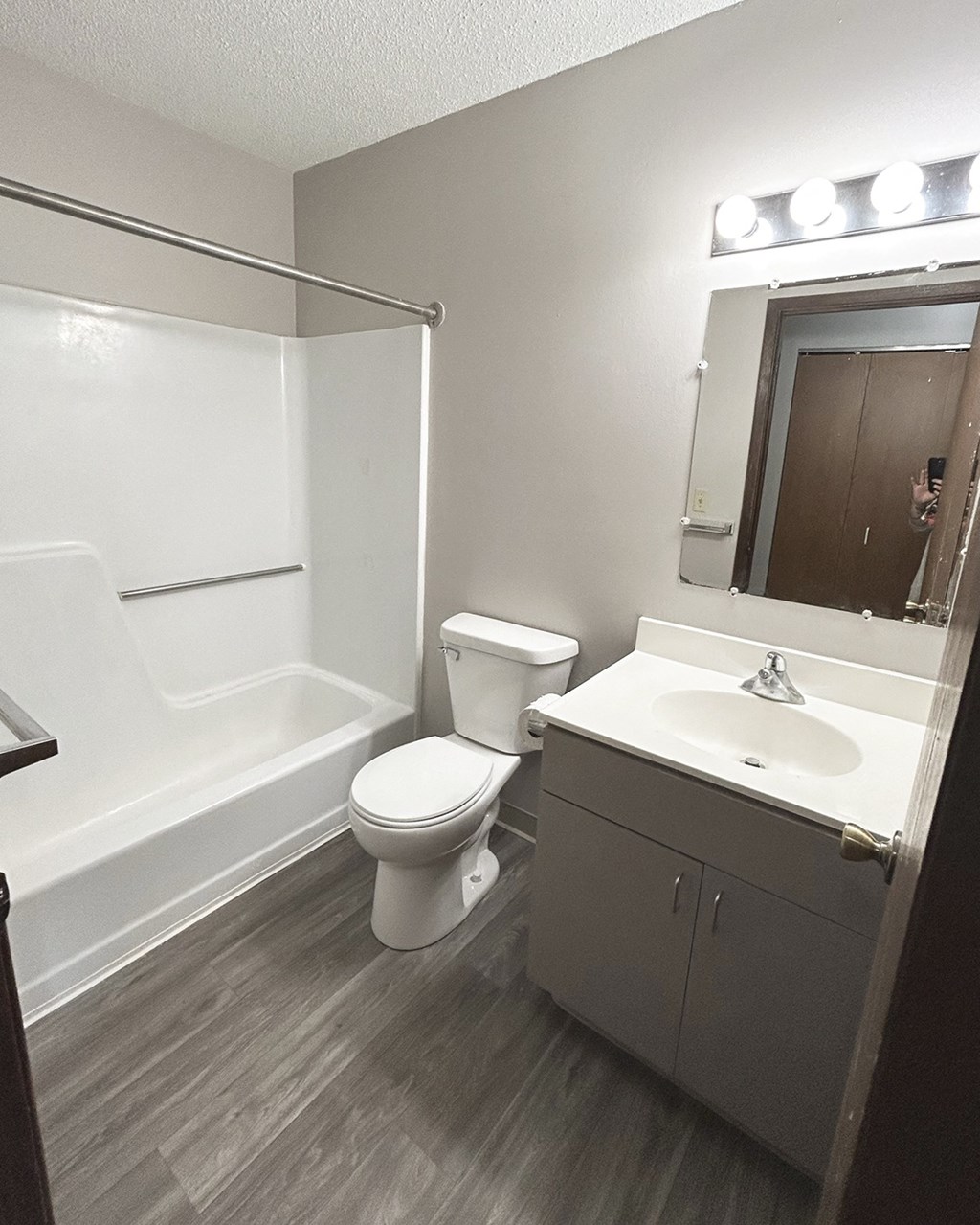 an empty bathroom with a toilet sink and tub