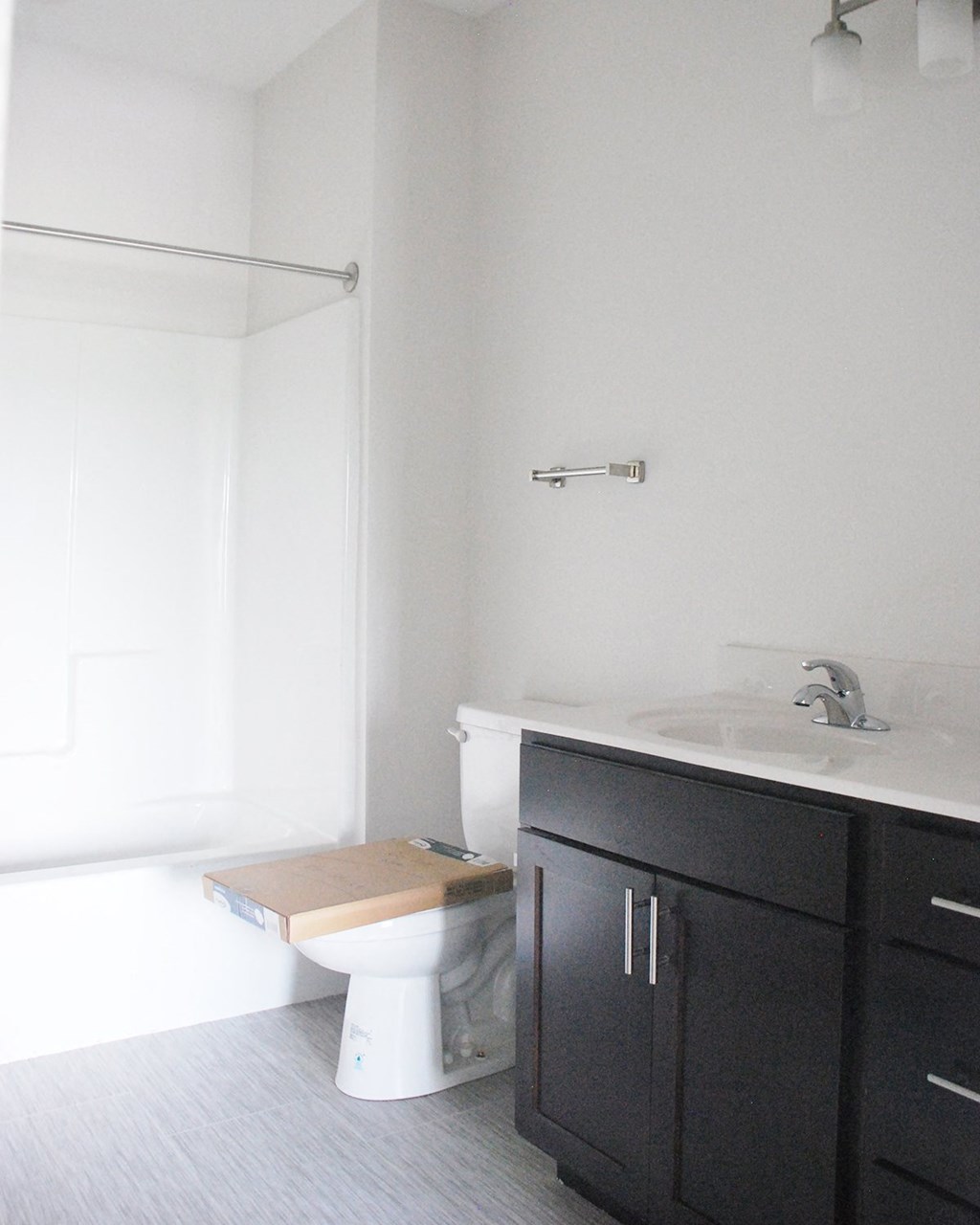 a bathroom with a toilet sink and bathtub