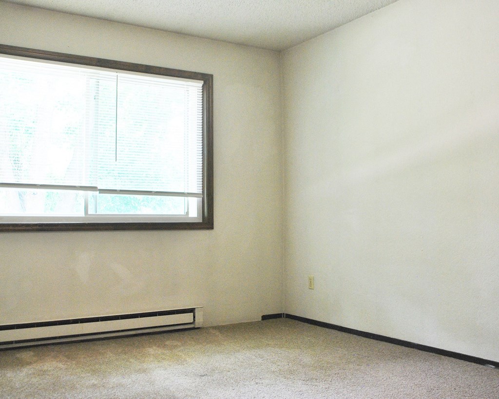 an empty room with a large window in it