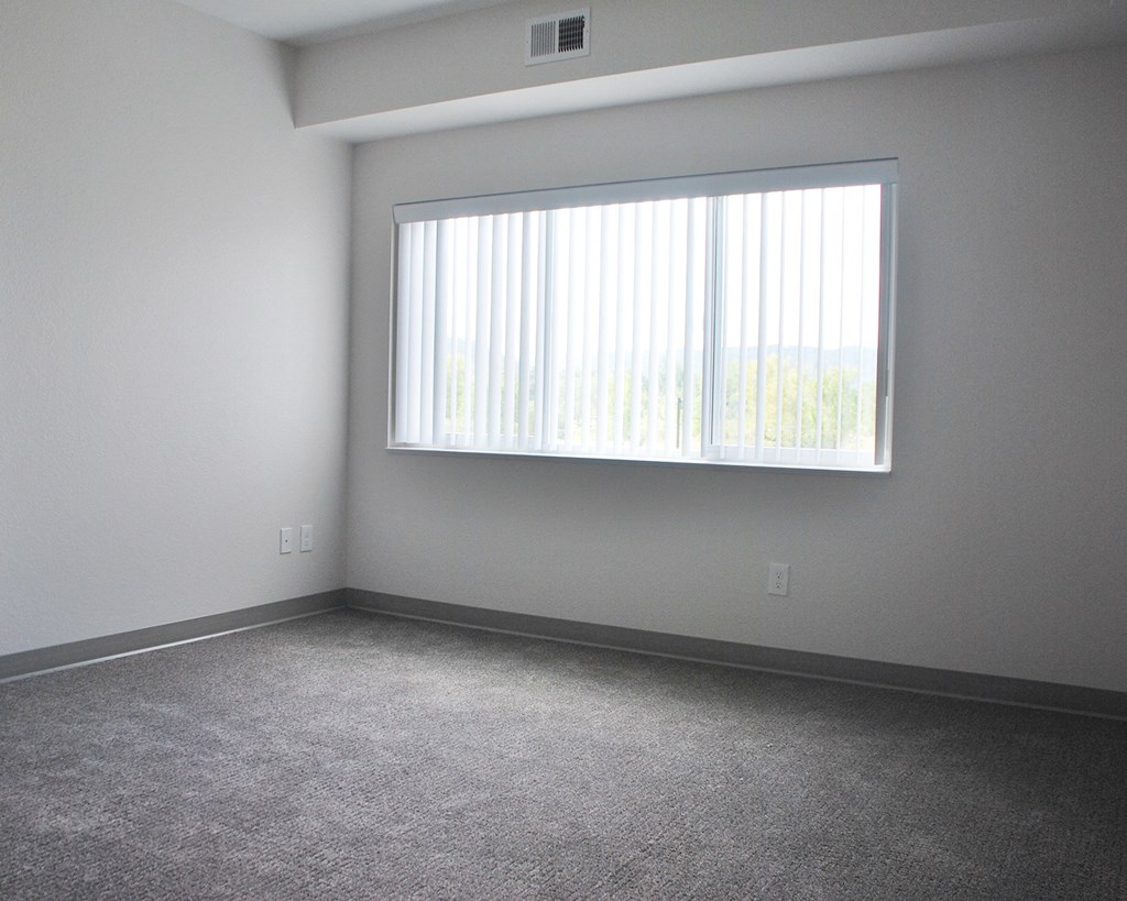 an empty room with a large window