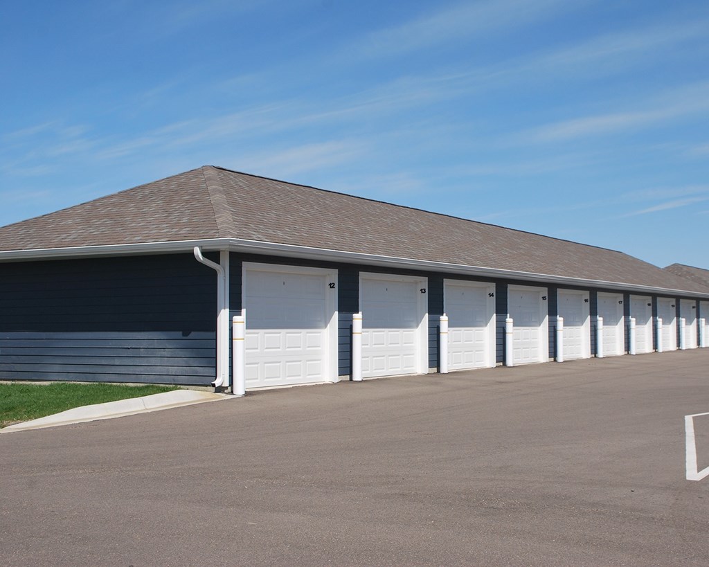 A long building with a row of garage doors.